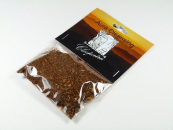 Przezroczysta torebka z ziołami do oczyszczania aury, opisana jako "Aura Cleansing Cleopatra".