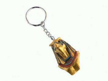 Breloczek z figurką egipskiego faraona w kolorach złotym, czarnym i czerwonym.