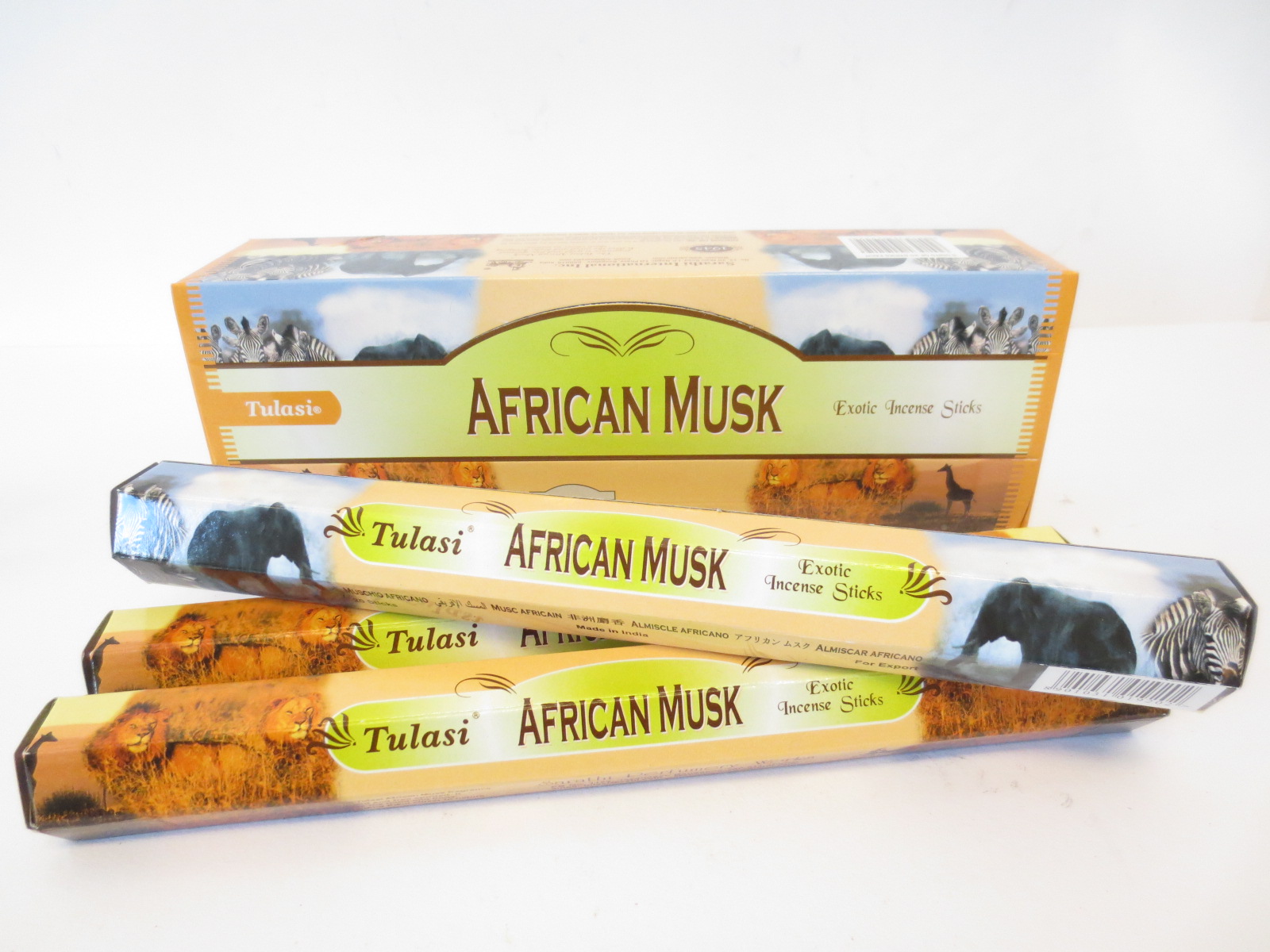 Patyczki zapachowe Tulasi African Musk w opakowaniach ozdobionych zwierzętami afrykańskimi.
